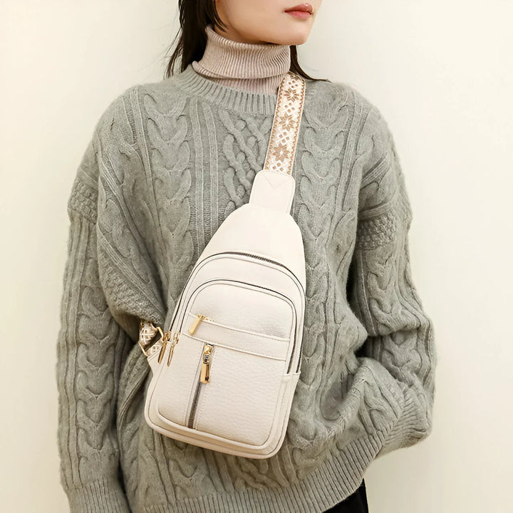 Women's Sling Bag with Geometric Pattern Strap and Multiple Zippered Compartments