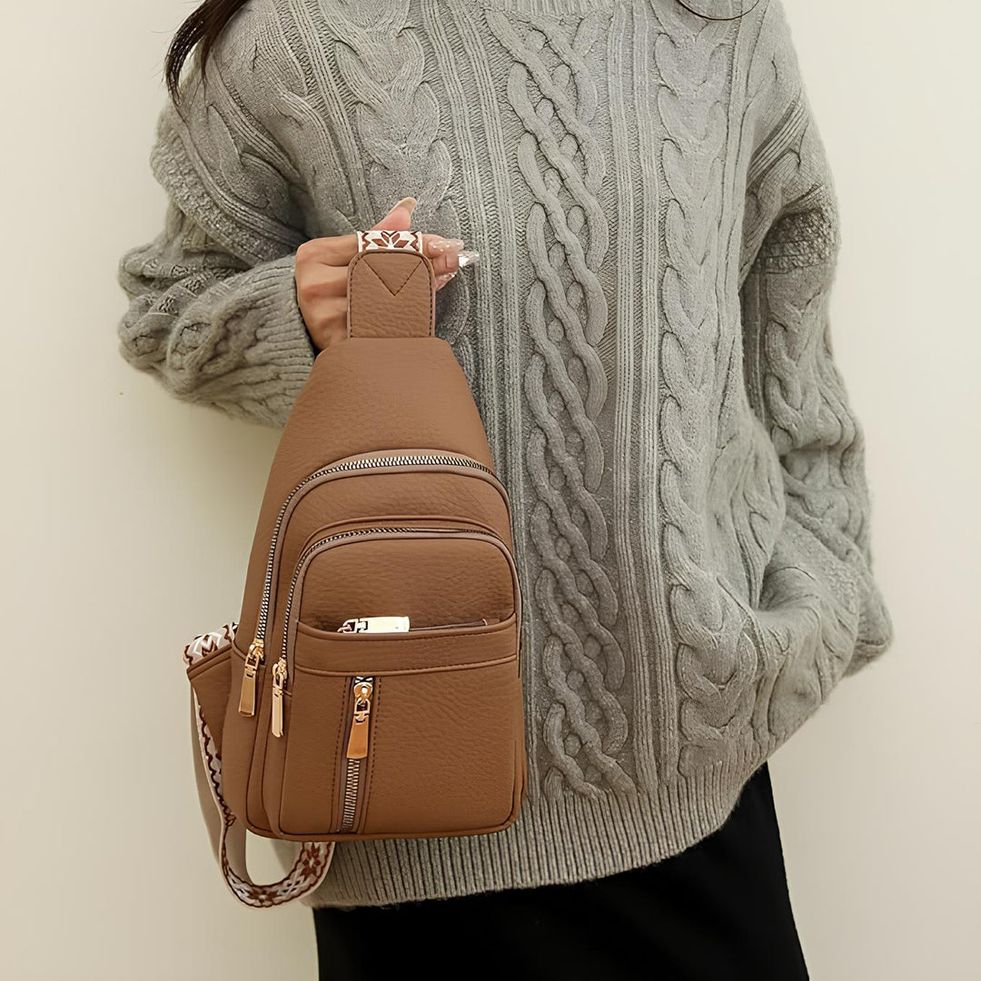 Women's Sling Bag with Geometric Pattern Strap and Multiple Zippered Compartments