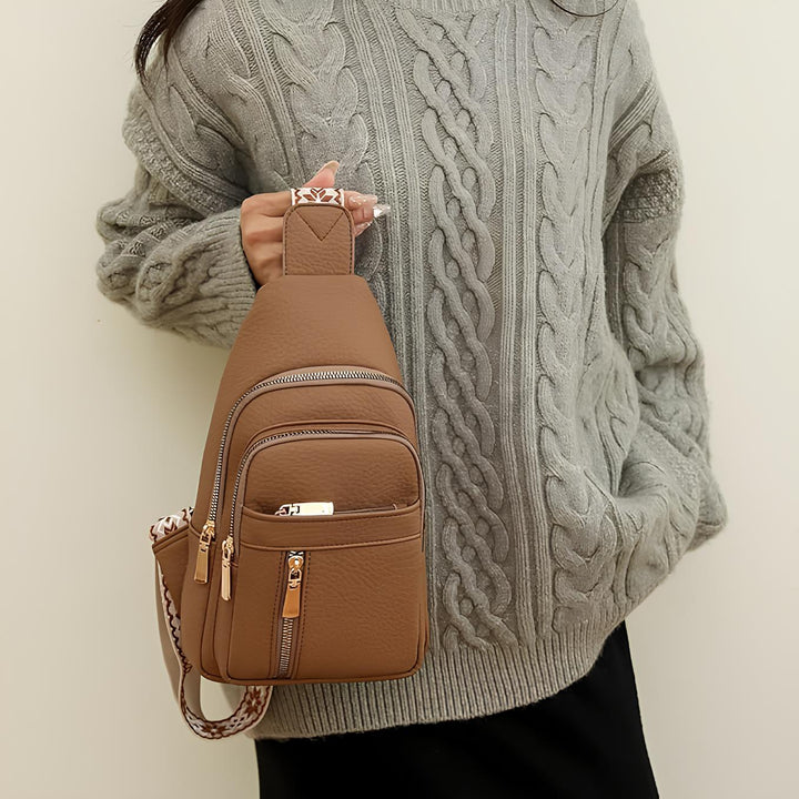 Women's Sling Bag with Geometric Pattern Strap and Multiple Zippered Compartments