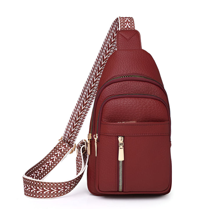 Women's Sling Bag with Geometric Pattern Strap and Multiple Zippered Compartments
